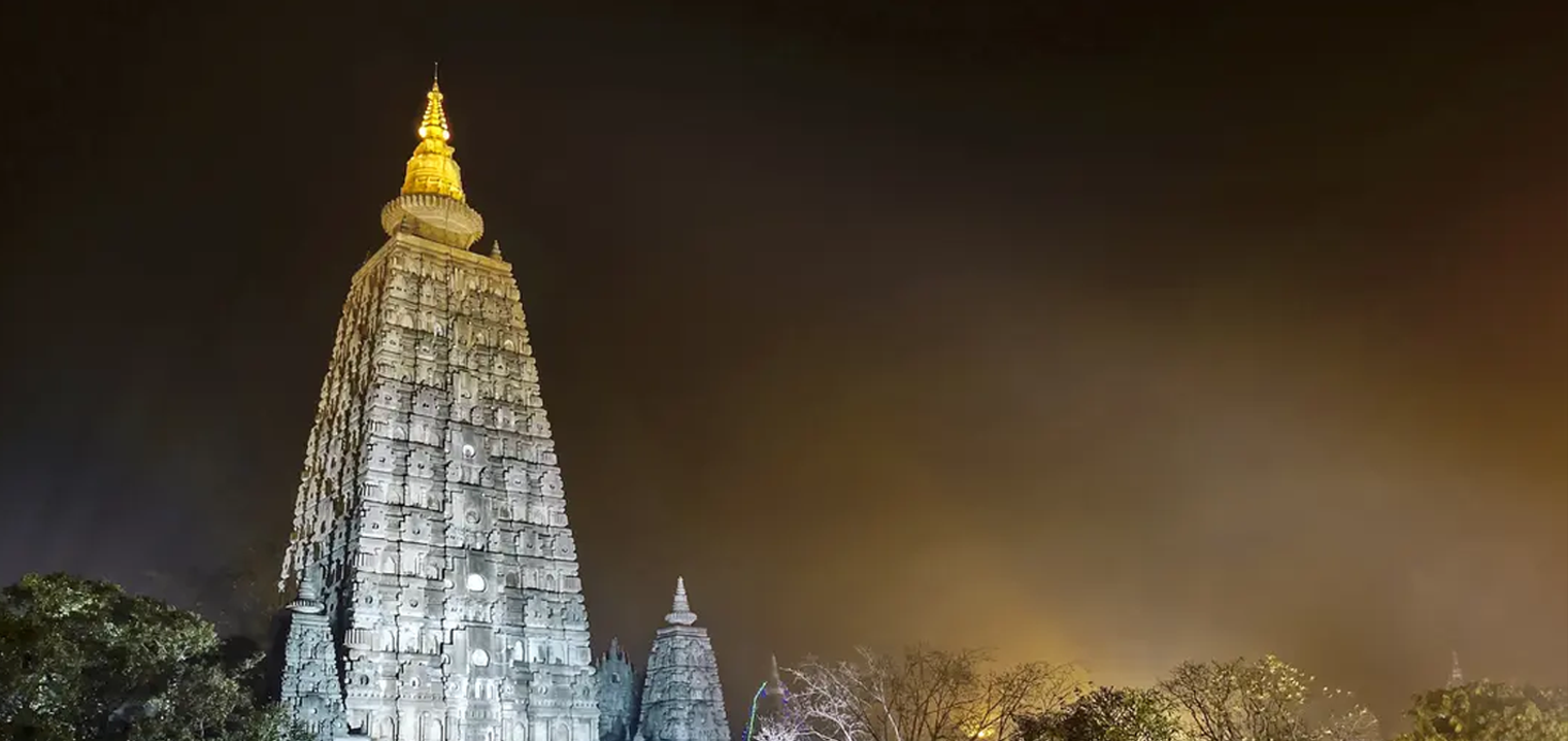 Mahabodhi Temple illuminated at night in Bihar